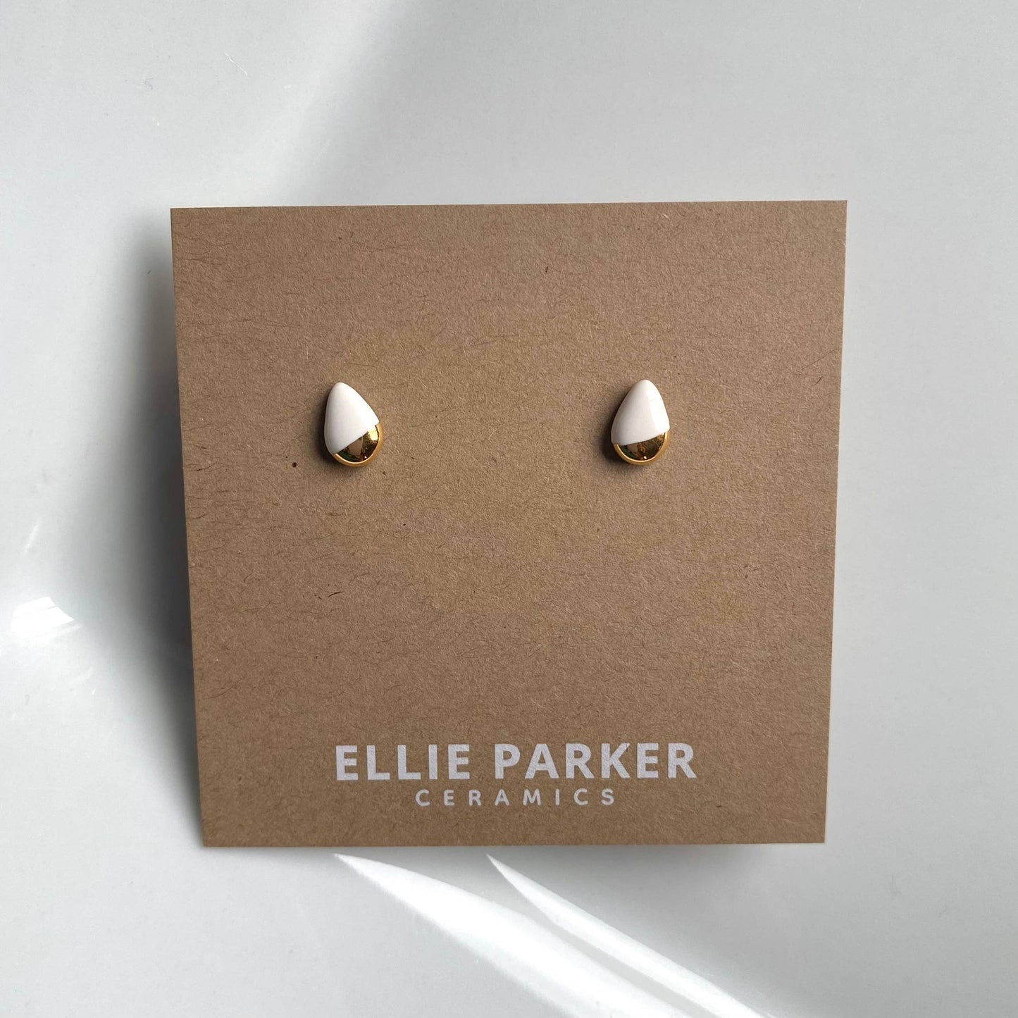 Teardrop White Ceramic Gold Accent Stud Earrings