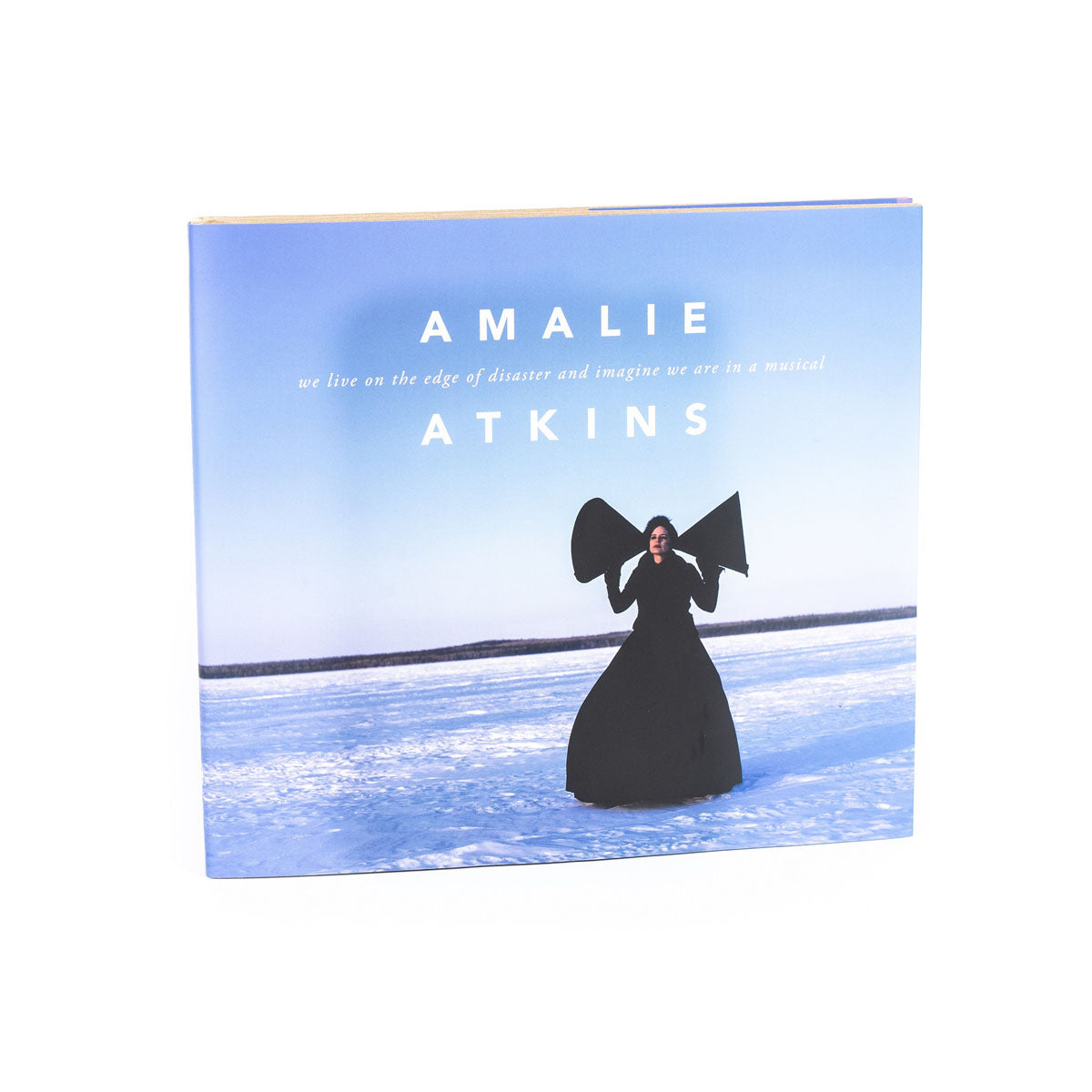 We live on the edge of disaster and imagine we are in a musical - Amalie Atkins