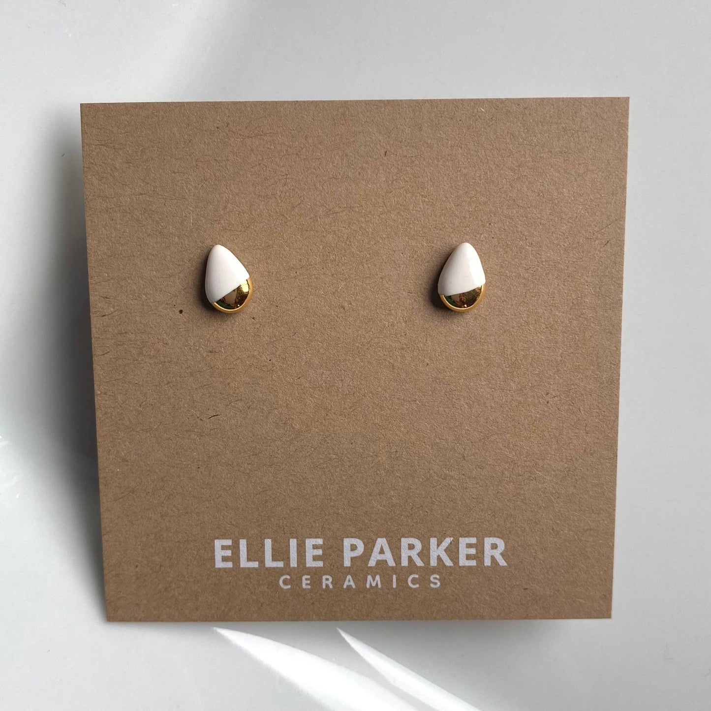 Teardrop White Ceramic Gold Accent Stud Earrings