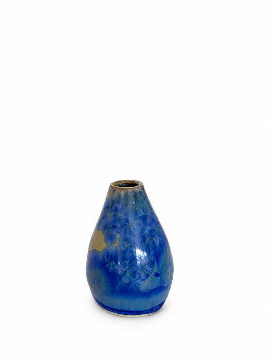 Small Large Blue Crystal vase on yellow background