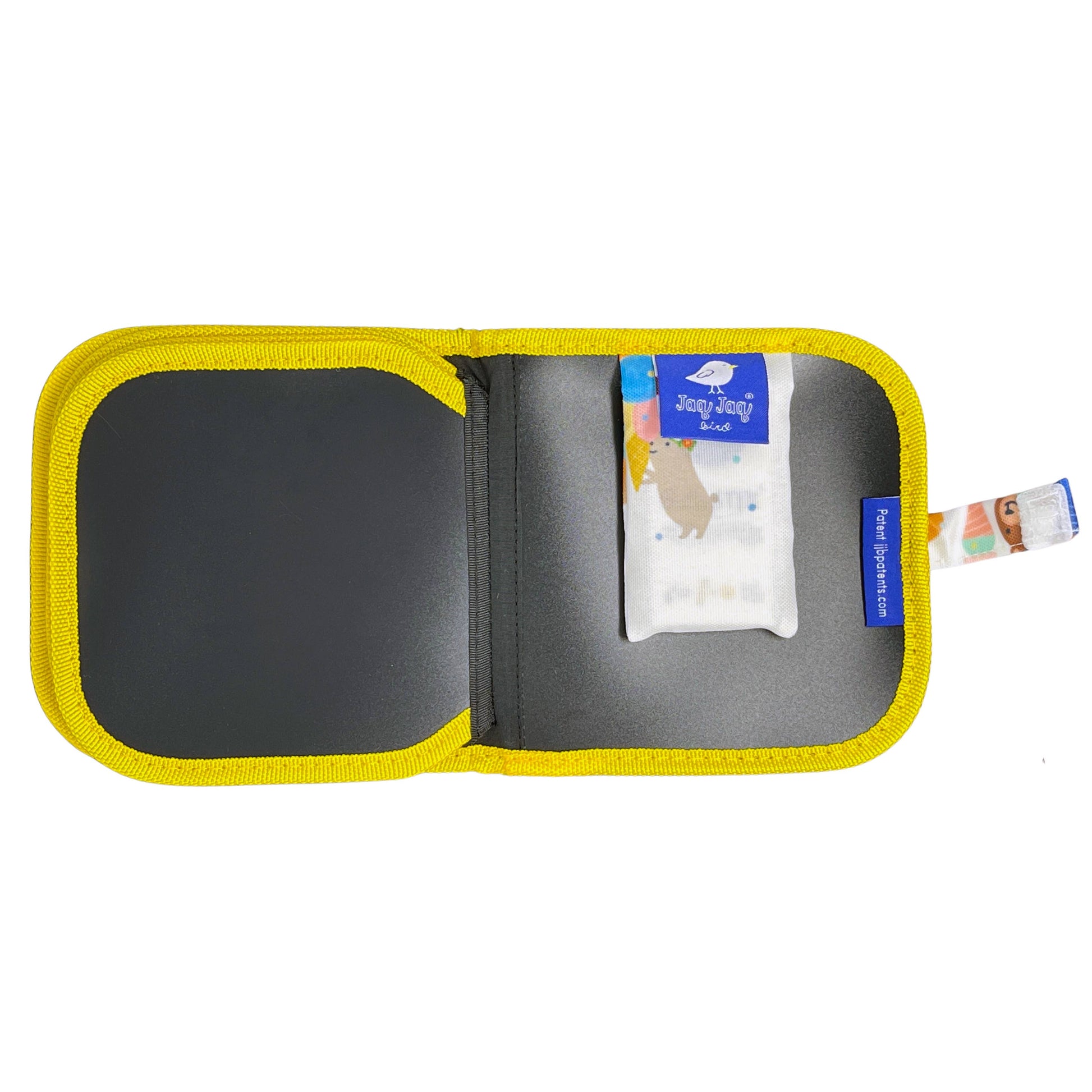 Open yellow case with gray interior, containing a small white packet and a blue label on a white background.